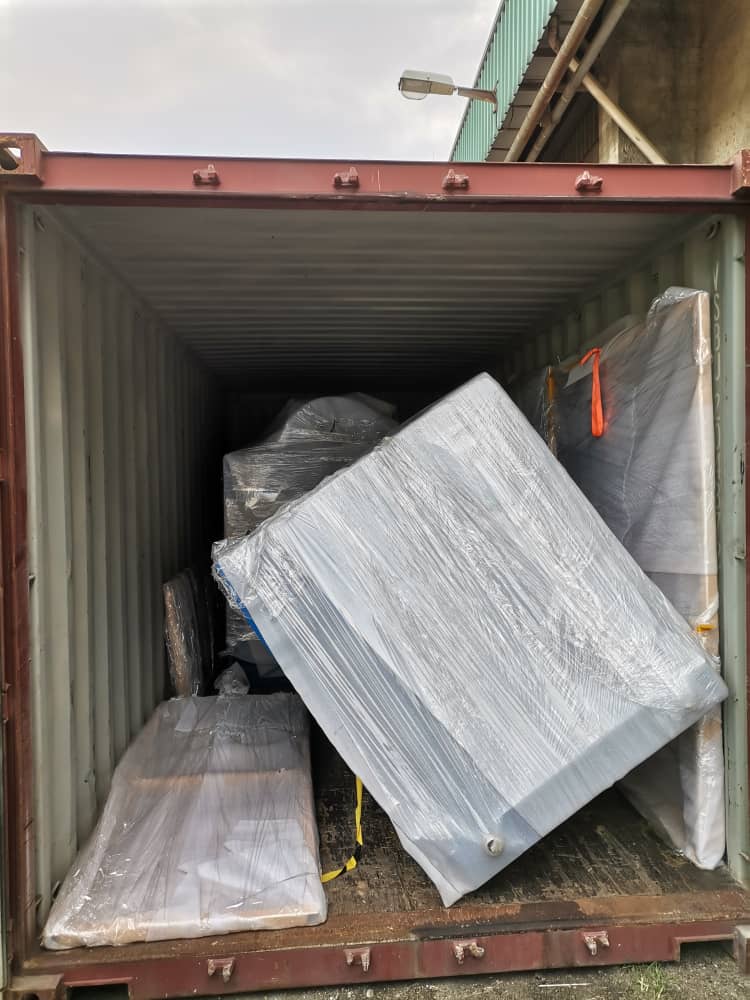 tipped machine of pallet changer inside container