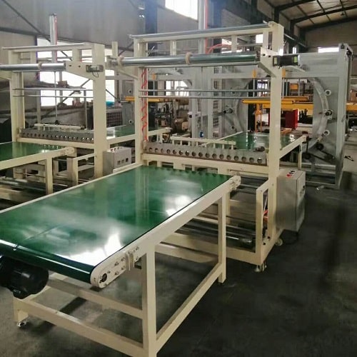 Horizontal spiral wrap packer with film dispenser HM-A1200-FD