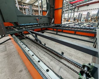 Orbital pallet wrapper on sliding rails