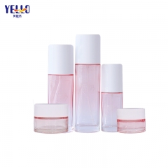 Venta al por mayor Gradient Pink Glass 30ml Frascos cosméticos y botellas de loción con bomba