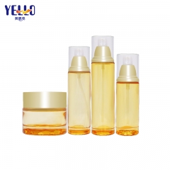 Clear Yellow Glass Lotion Bottles With Pump And Skincare Cream Jar