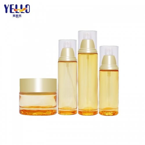 Clear Yellow Glass Lotion Bottles With Pump And Skincare Cream Jar