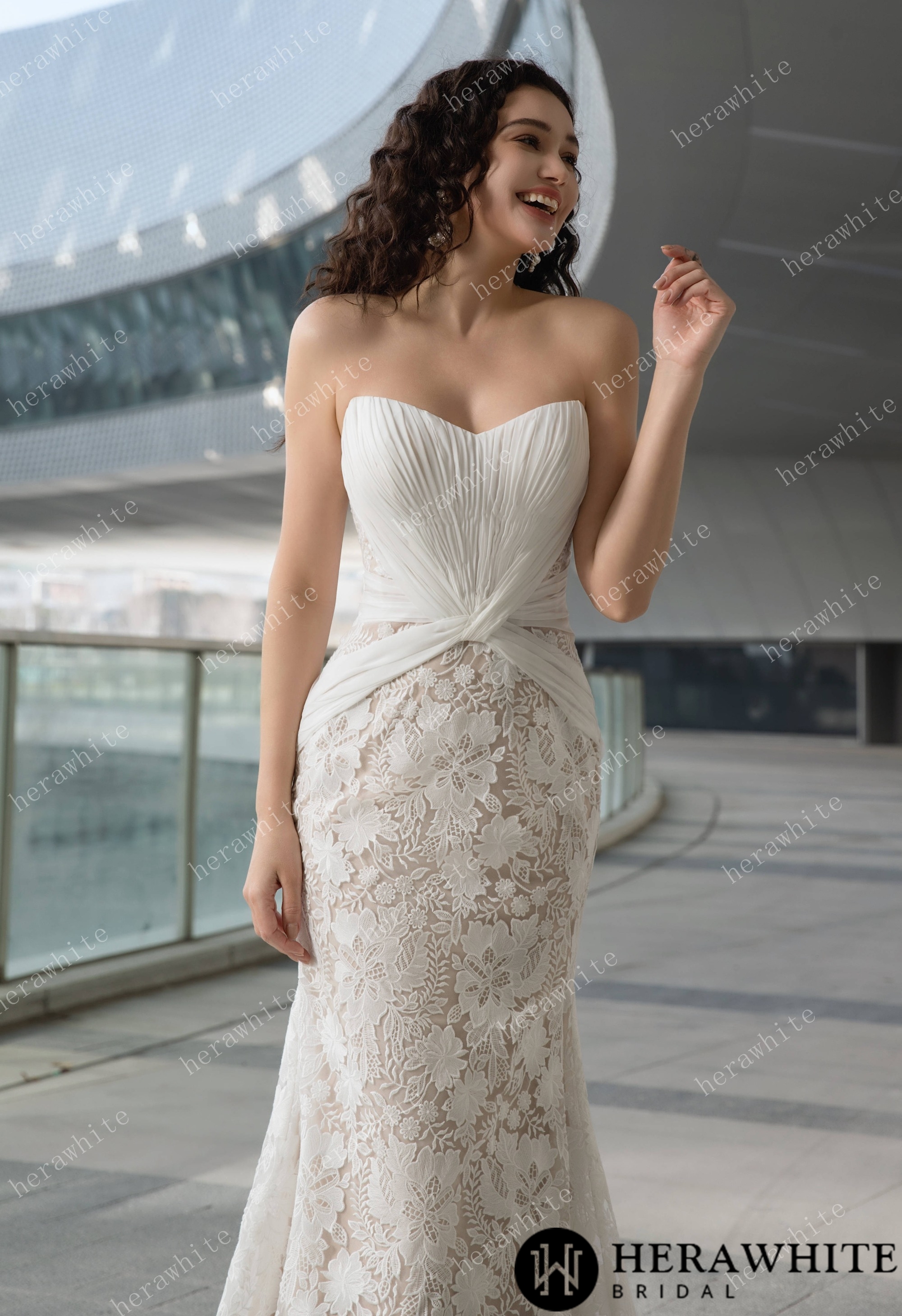 Elegant Strapless Pleated Wedding Dress with Lace Mermaid Skirt and Flowing Sheer Cape