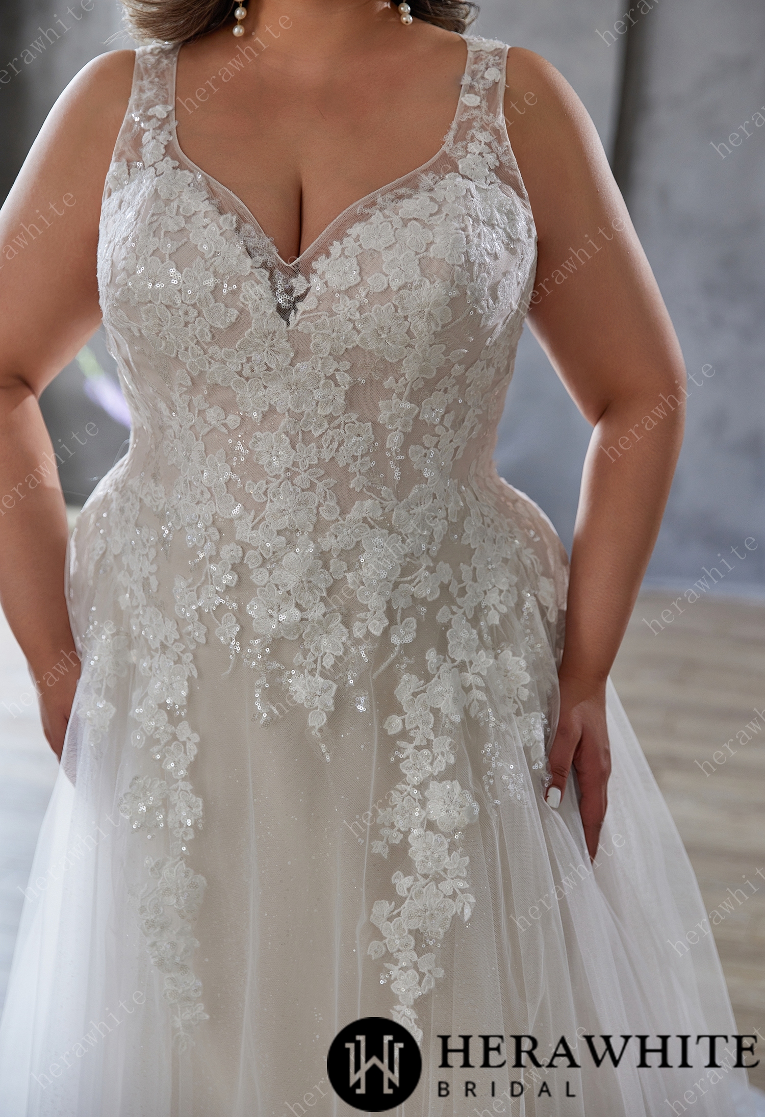 Elegant and Ethereal Plus-Size Wedding Dress with Lace and Sequins