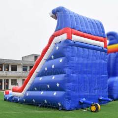 red inflatable water slide with pool