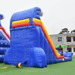 red inflatable water slide with pool