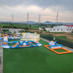 Large inflatable water park with inflatable flotation obstacles