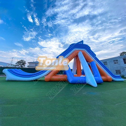 Large inflatable water park with inflatable flotation obstacles