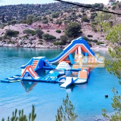 Large inflatable water park with inflatable flotation obstacles