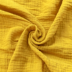 Mustard soft and lightweight organic cotton muslin double layered gauze fabric