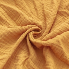 Dark dijon cotton muslin crinkle double layered gauze fabric