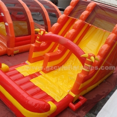 Orange inflatable bouncy castle with water double slides