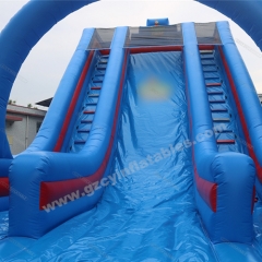 Large blue inflatable dry slide with arch