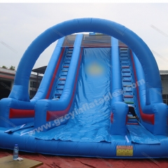 Large blue inflatable dry slide with arch