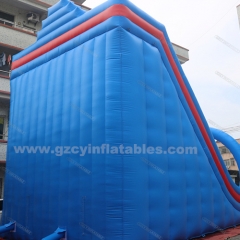 Large blue inflatable dry slide with arch