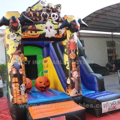 Halloween themed inflatable pumpkin castle slide combo