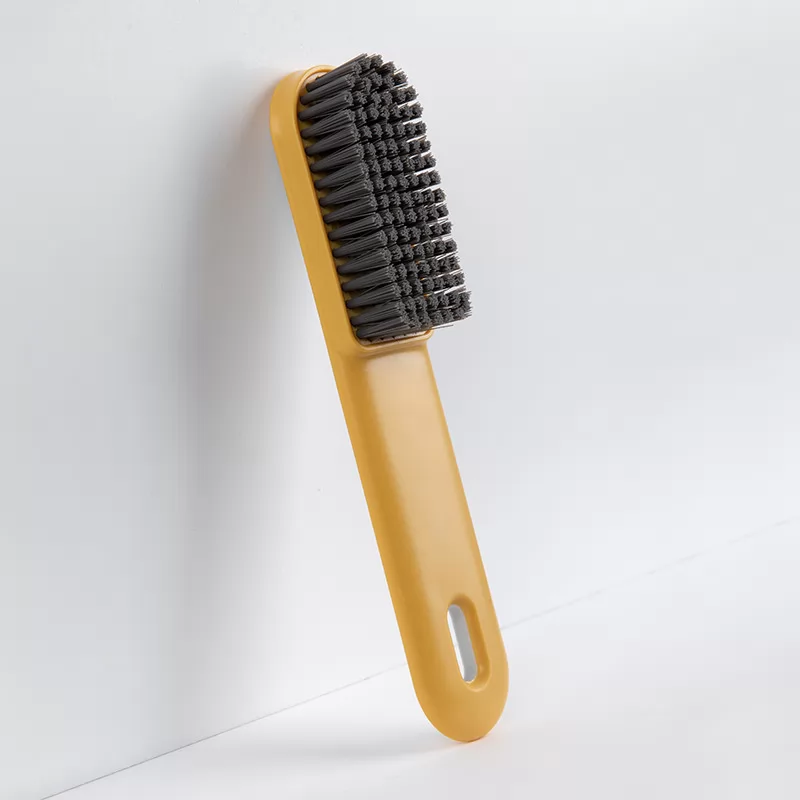 Yellow shoe brush