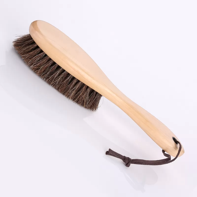 Long-handled horse hair brush for logs