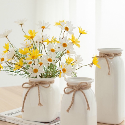 Simple white ceramic vase with hemp rope