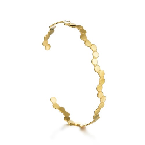 Dot wave cuff bracelet in gold plated stainless steel