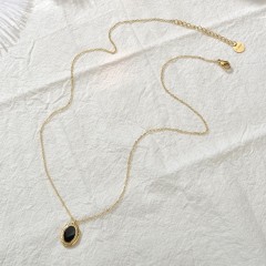 Gold and black resin medallion necklace in stainless steel