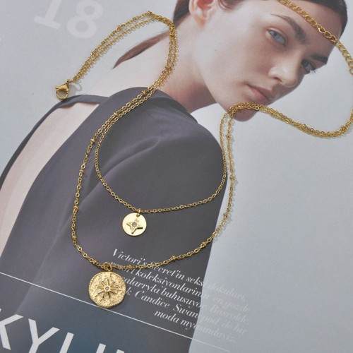 Hammered sun medallion and north star medal layered necklace