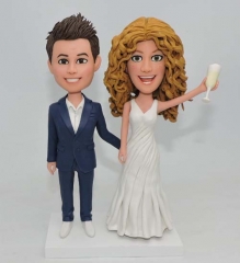 Custom Bitmoji cake toppers holding champagne