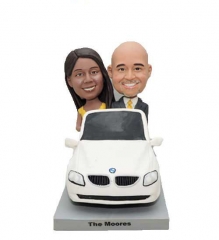 Funny bride and groom cake topper in car