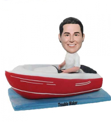 Bobble head man sitting in boat