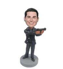 Cool bobble head doll holding gun