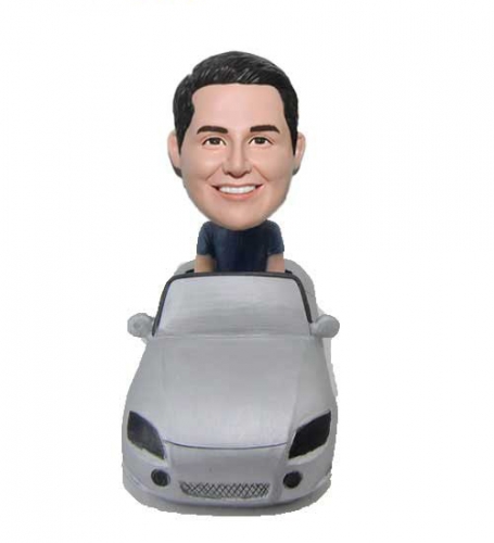 Man sitting in car bobbleheads