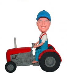 Bobble head driving tractor