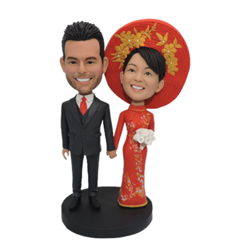 Bobble head cake topper with Vietnamese bride