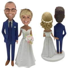 Custom bride and groom bobbleheads grabbing butts