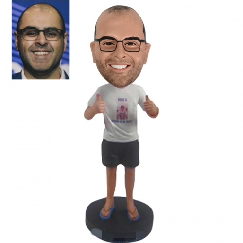 Bobble head doll with thumbs up