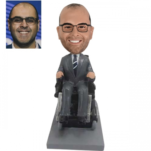 Bobbleheads in wheelchair