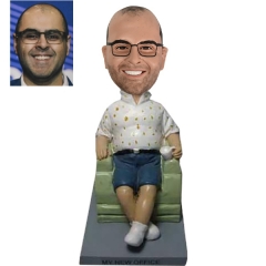 custom bobbleheads sitting in Sofa