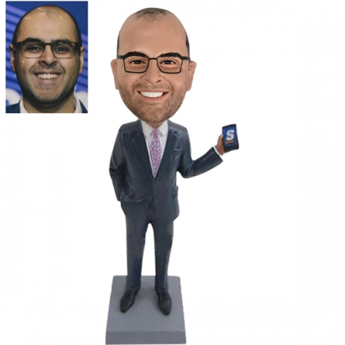 Custom bobblehead in suit holding cellphone