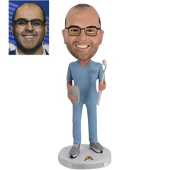 Dentist bobblehead with beer and brush