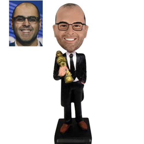 Personalized Bobbleheads holding Oscar statuette