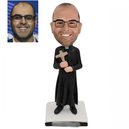 Priest bobblehead with crucifix