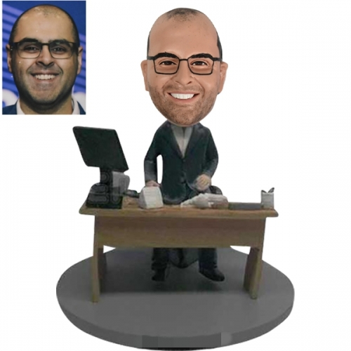 Custom bobblehead before desk with computer