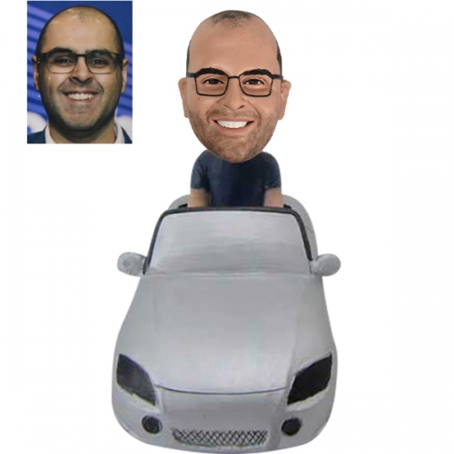 Custom bobblehead sitting in Car