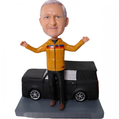 Custom Bobblehead standing before Cadillac