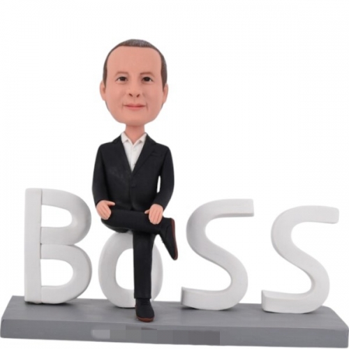 Personalized Boss Bobble head sitting on company logo