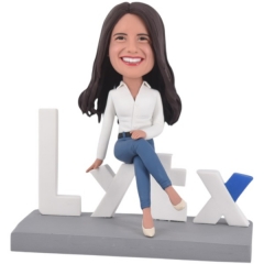Custom Bobblehead Sitting on Company Logo