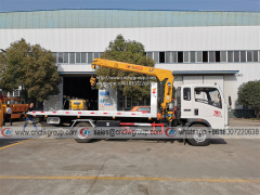 HOWO RHD 5 ton tilt tray truck roll back towing a car with a truck wrecker