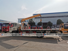 HOWO RHD 5 ton tilt tray truck roll back towing a car with a truck wrecker