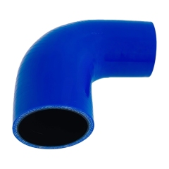 Blue high performance silicone hose connector installed as a radiator intake hose in a car engine.