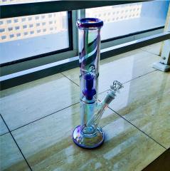 purple flower inside glass water bong